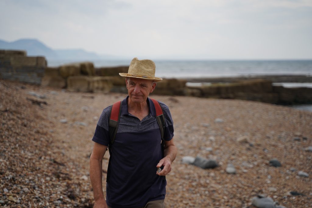 Bob the abstract artist on the beach in Lyme Regis finding inspiration from nature